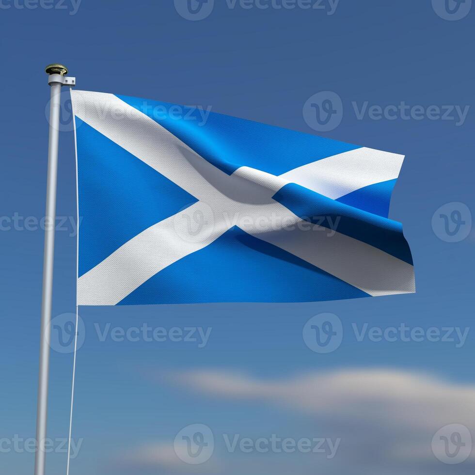 Scotland Flag is waving in front of a blue sky with blurred clouds in the background photo