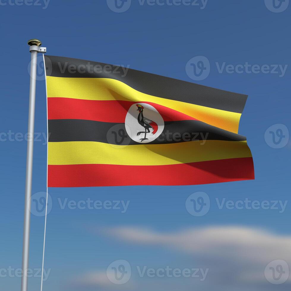 Uganda Flag is waving in front of a blue sky with blurred clouds in the background photo