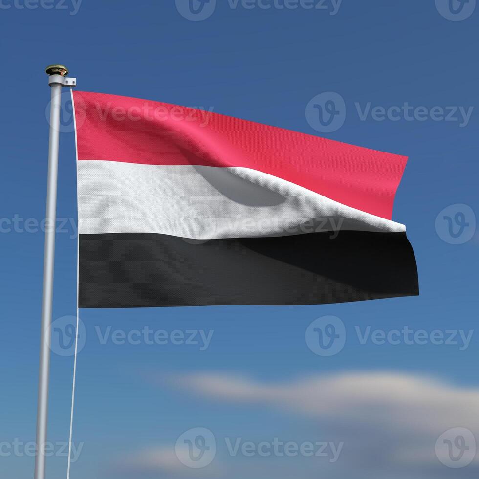 Yemen Flag is waving in front of a blue sky with blurred clouds in the background photo