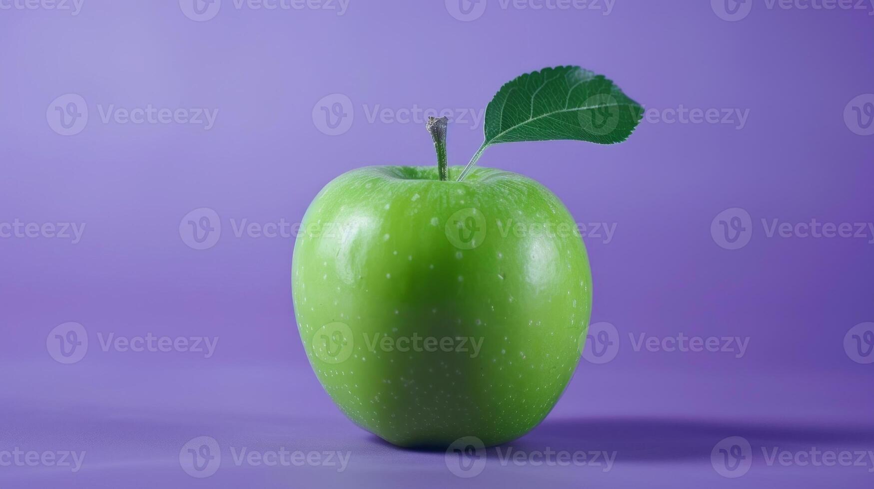 Fresh ripe green apple in purple background photo