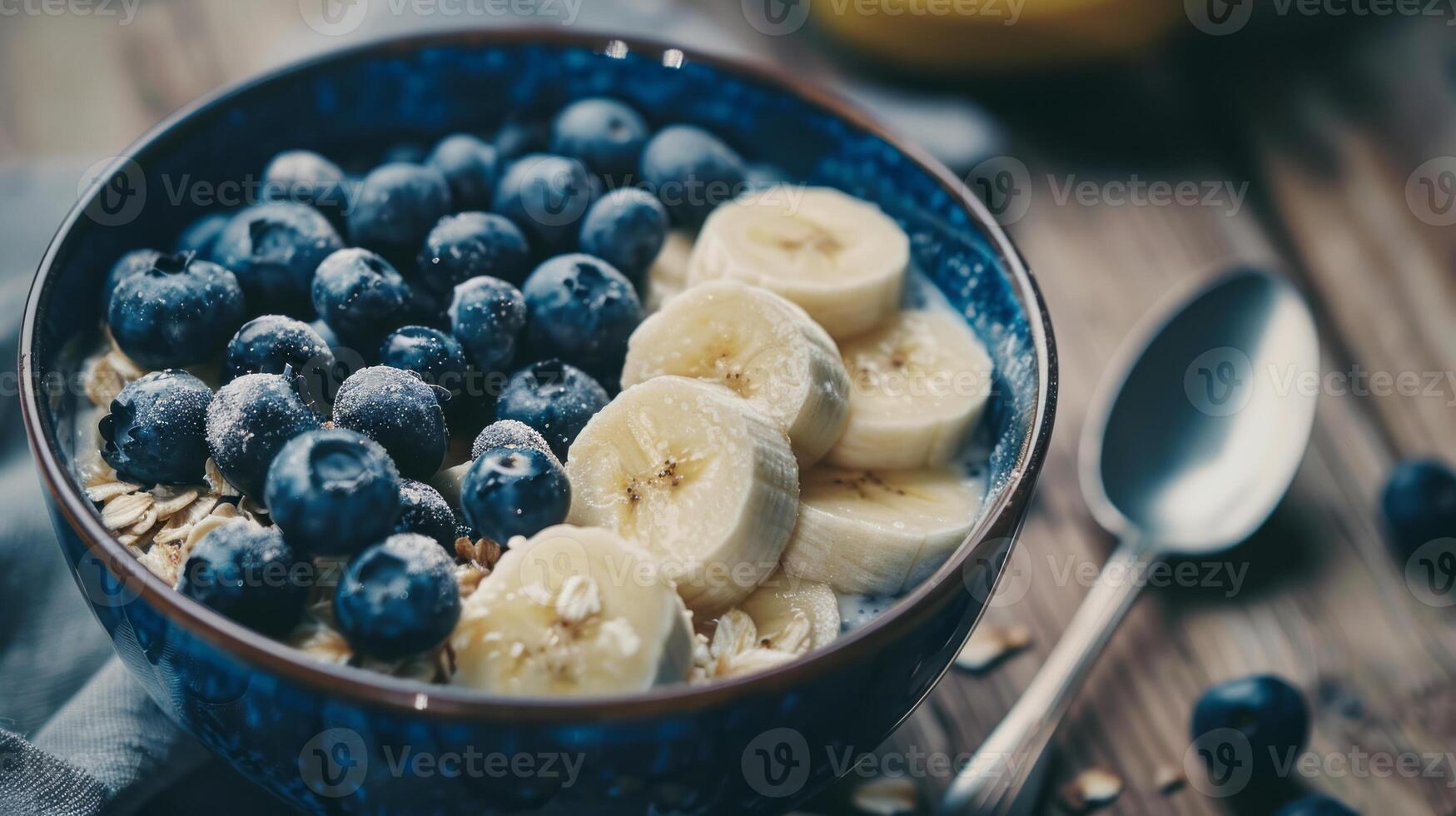a breakfast bowl with blueberries and bananas, a breakfast bowl with blueberries and bananas. photo
