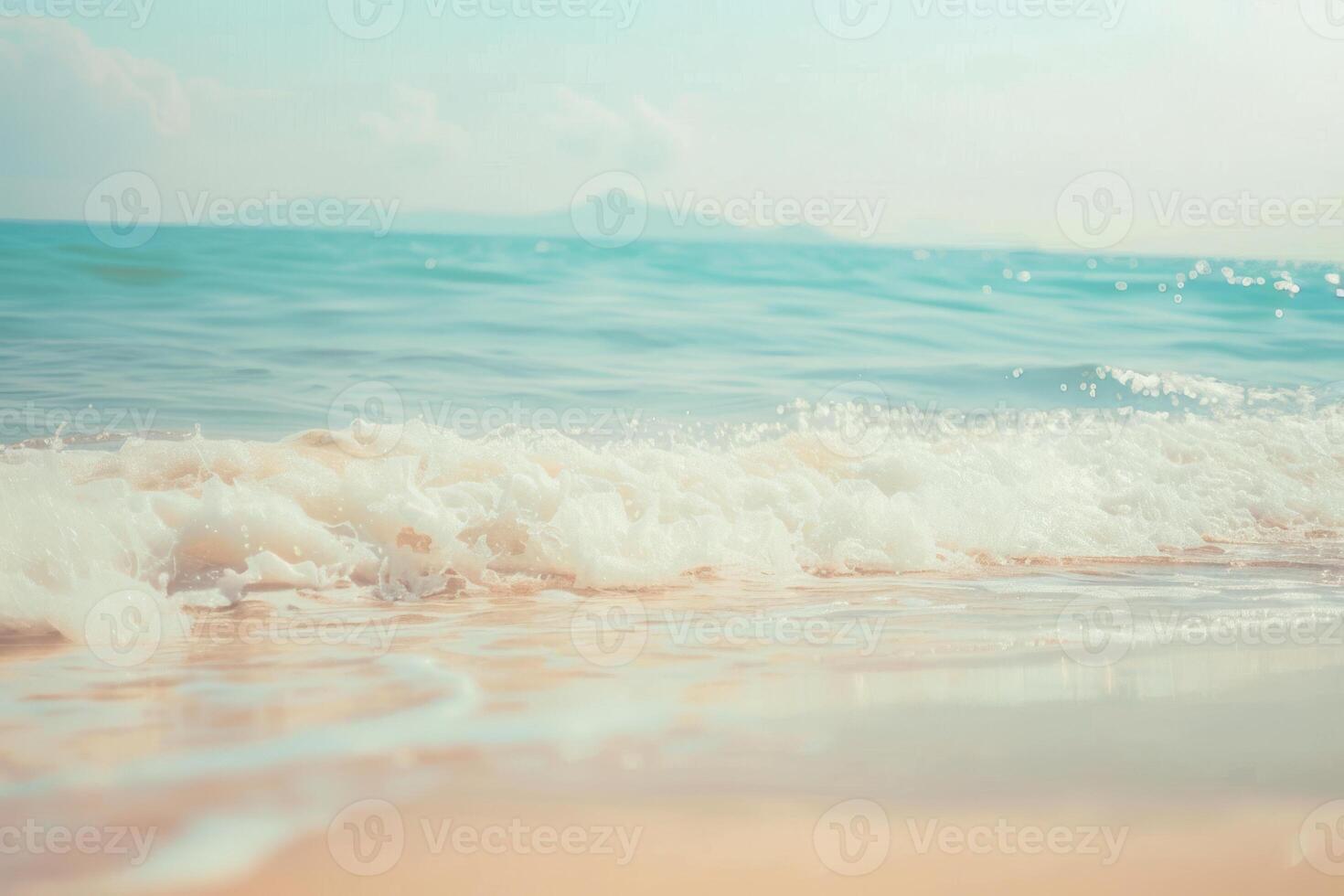 The ocean is calm and the water is a beautiful shade of blue photo