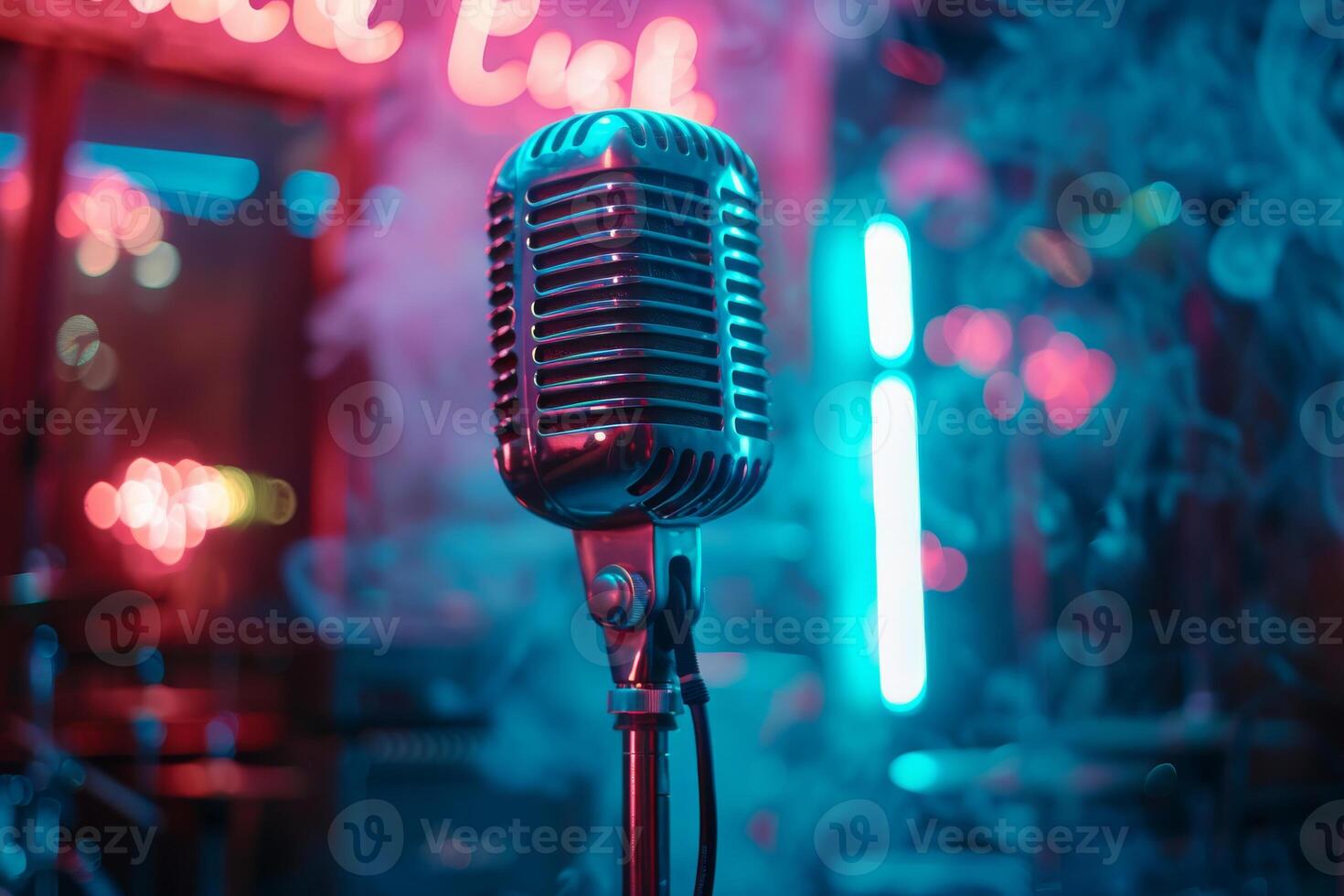 A microphone is on a stand in front of a neon sign photo