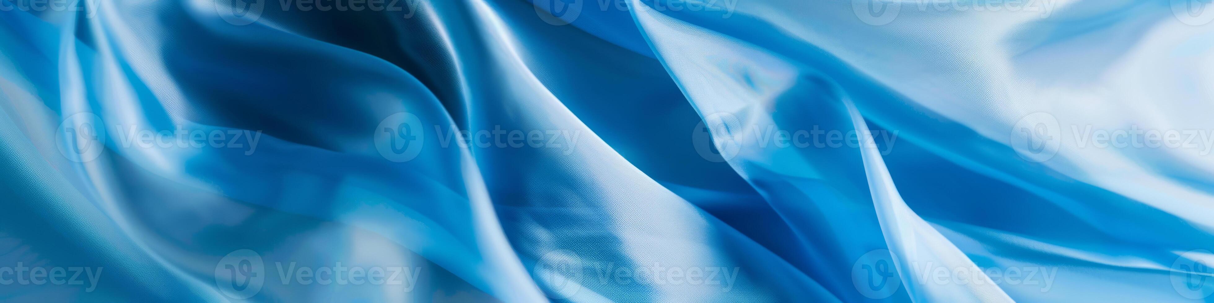 Smooth Flowing Ribbon of Blue Silk Gently Undulating photo