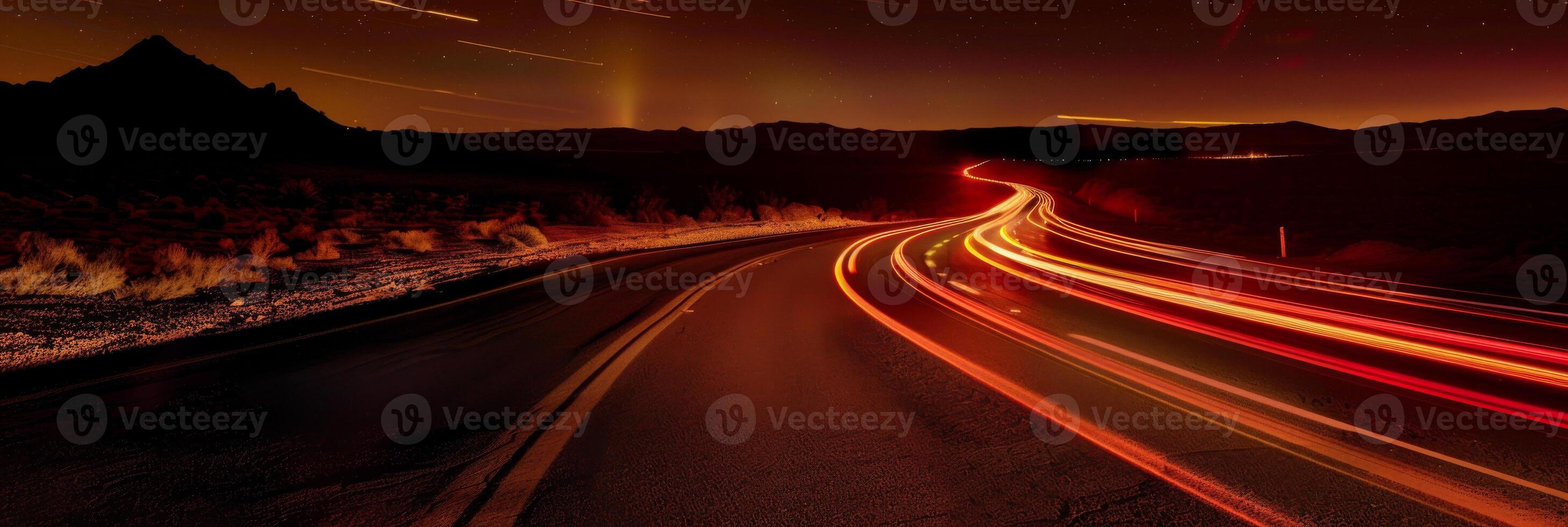 A long road with a mountain in the background photo