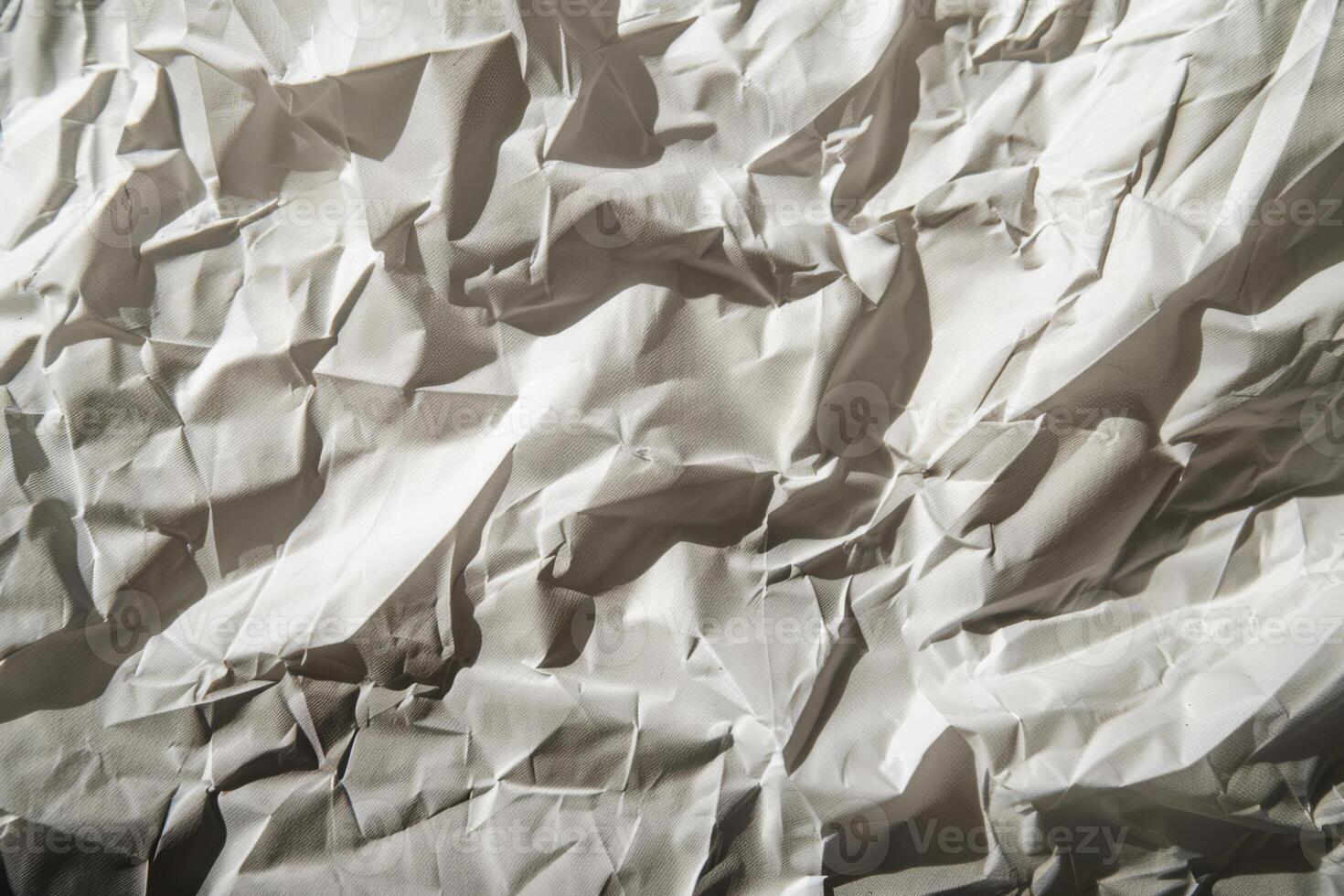 The is a close up of a piece of paper with a lot of wrinkles and creases photo