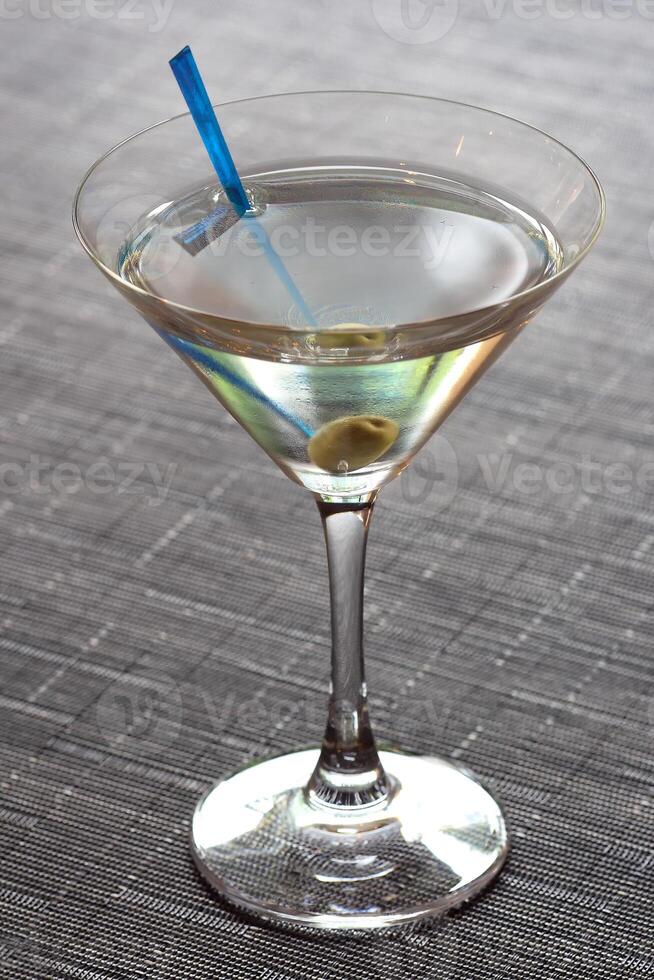Dry Martini, classic drink with gin, dry vermouth and lemon peel photo