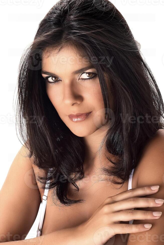 beautiful brunette model posing in classic black dress on white background photo