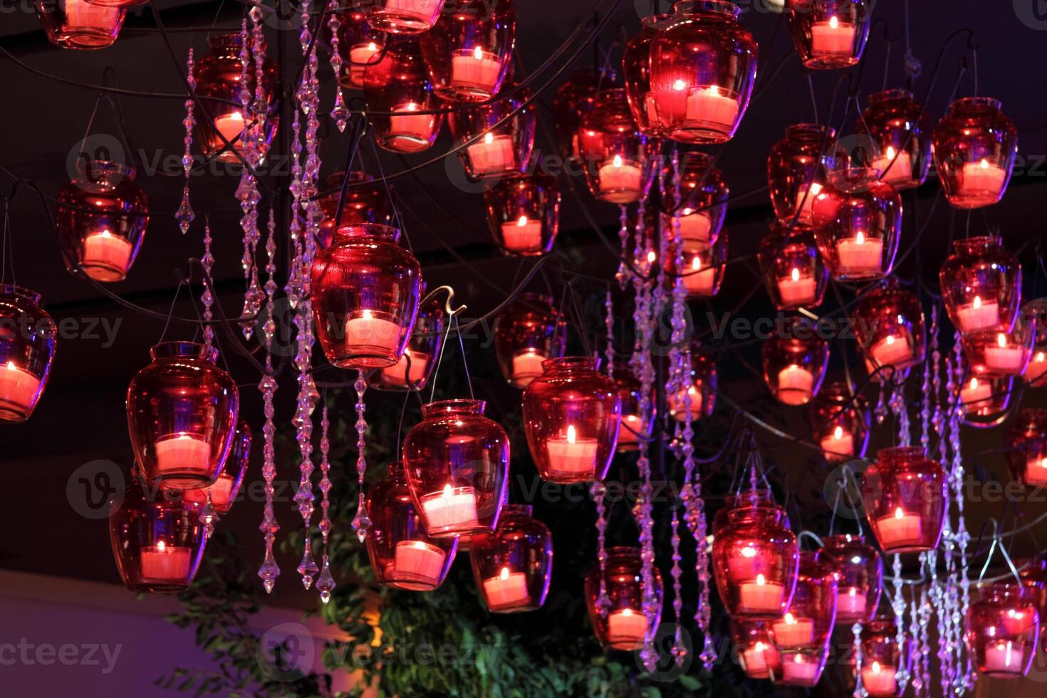 sophisticated party decoration with candles, flowers, tables and specialized lighting photo