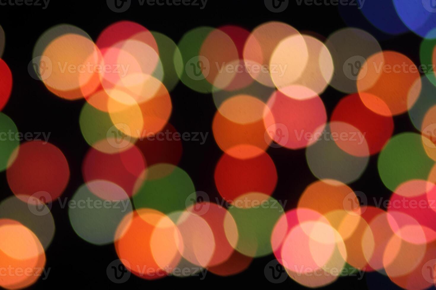 colorful and defocused lights on black background photo