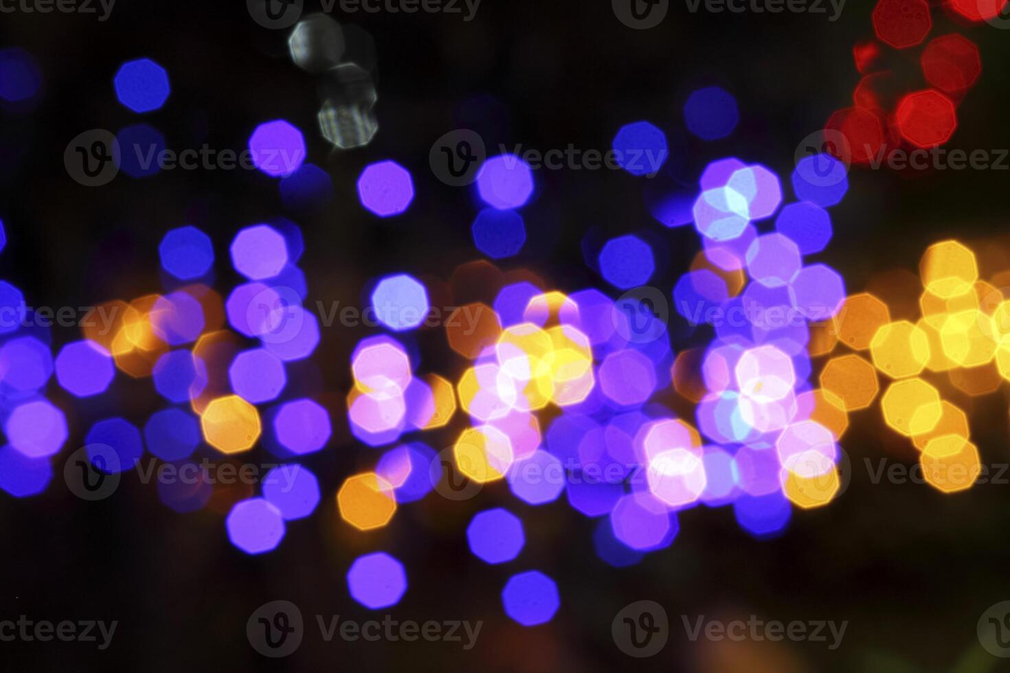 colorful and defocused lights on black background photo