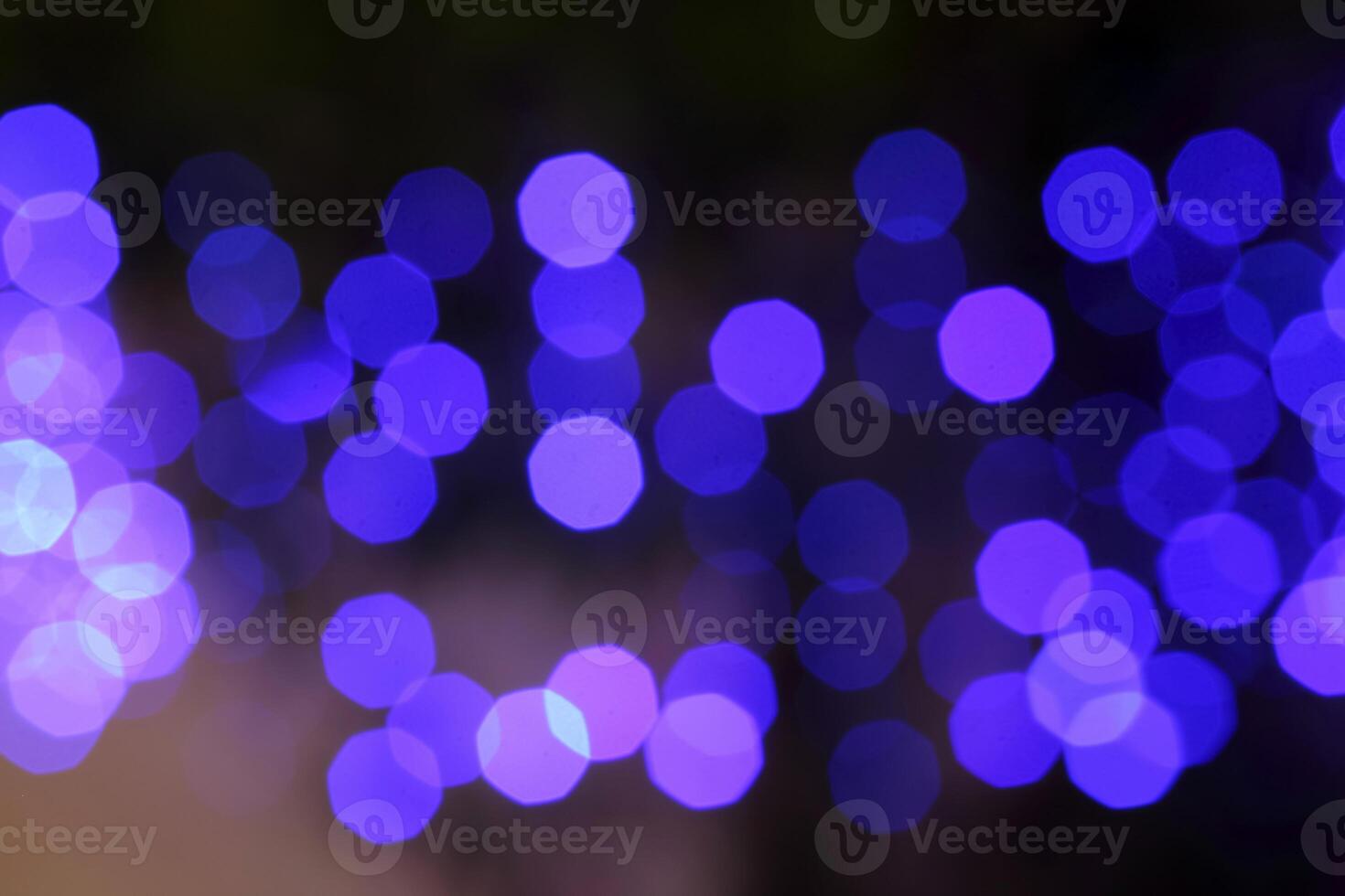 colorful and defocused lights on black background photo