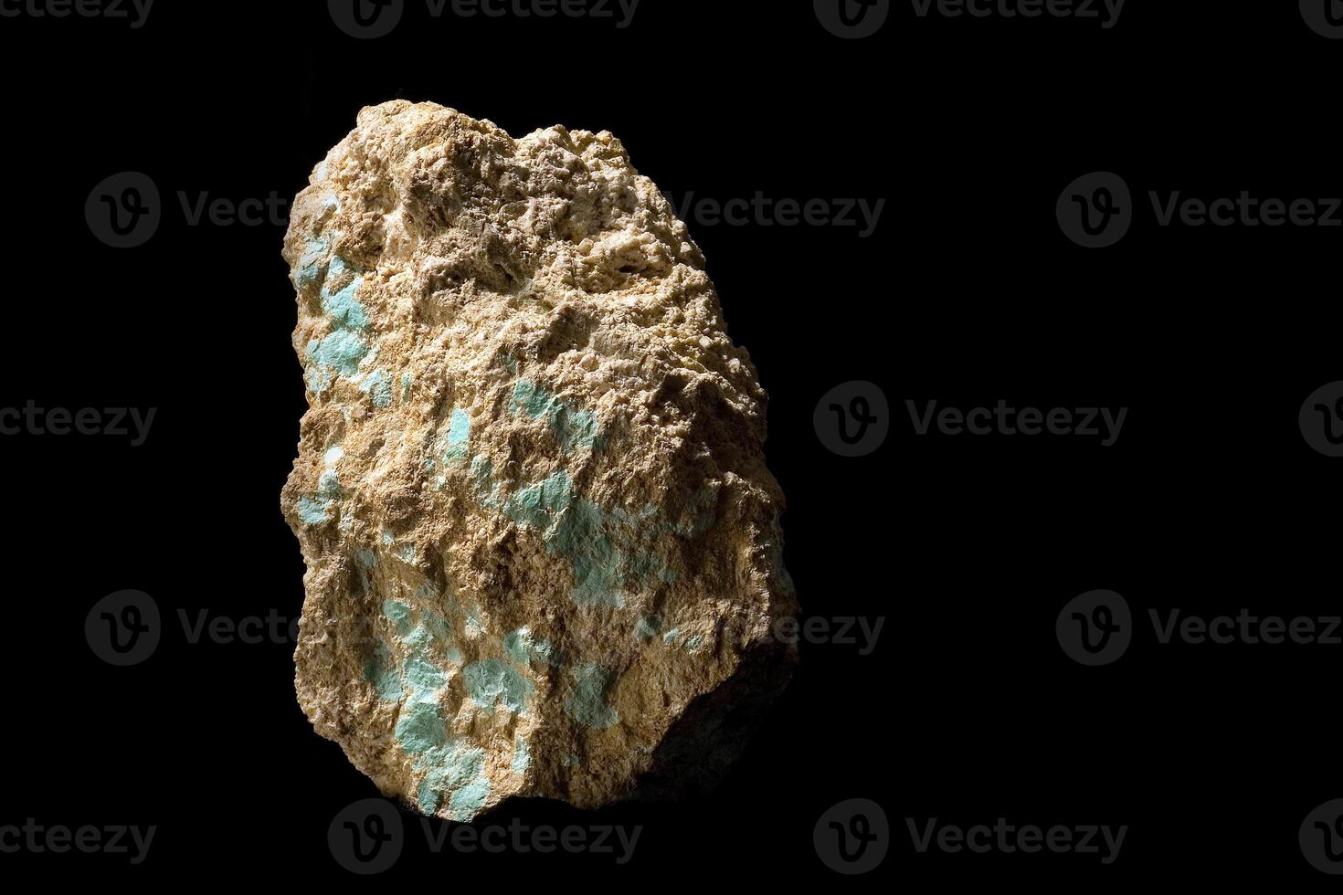 cut and rough precious stones on a black background photo