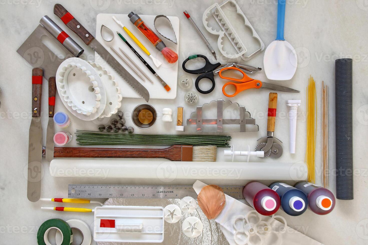 equipment, scissors and utensils to work on making and decorating wedding cakes photo