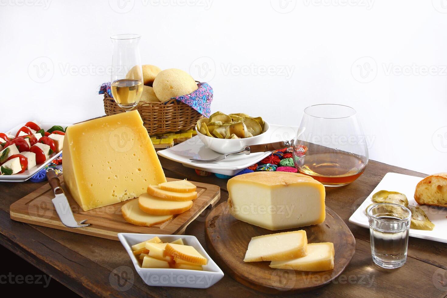 wooden table with snacks, fruits and cheeses to be tasted with pinga, the famous Brazilian brandy photo