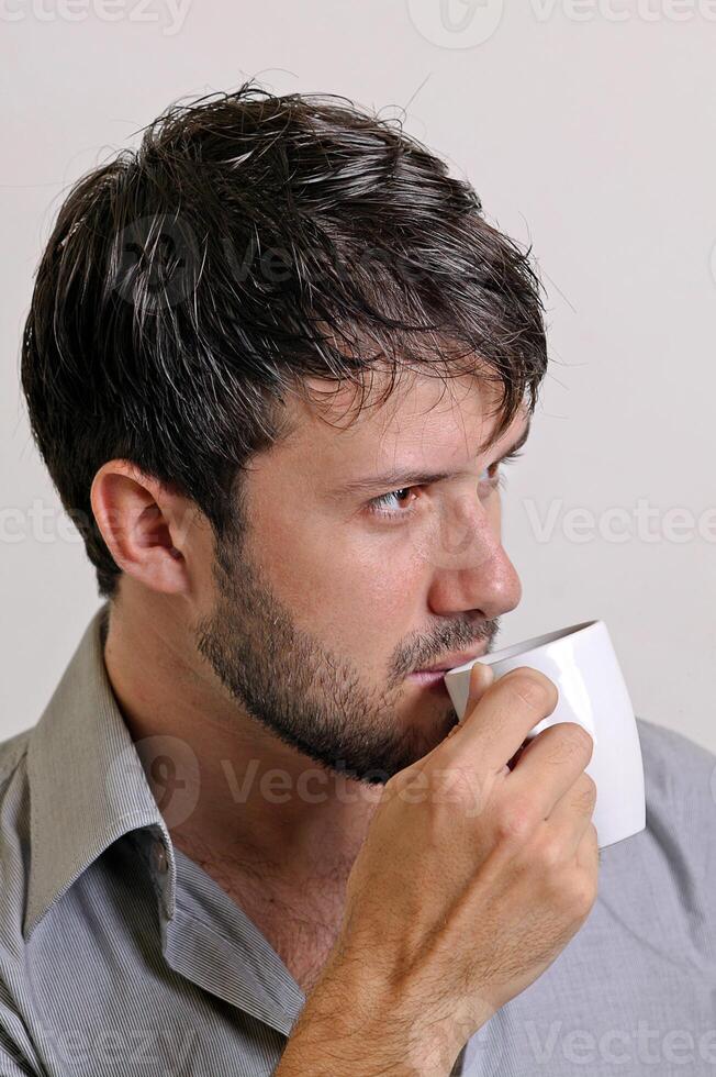 young man with beard in different situations on neutral background photo