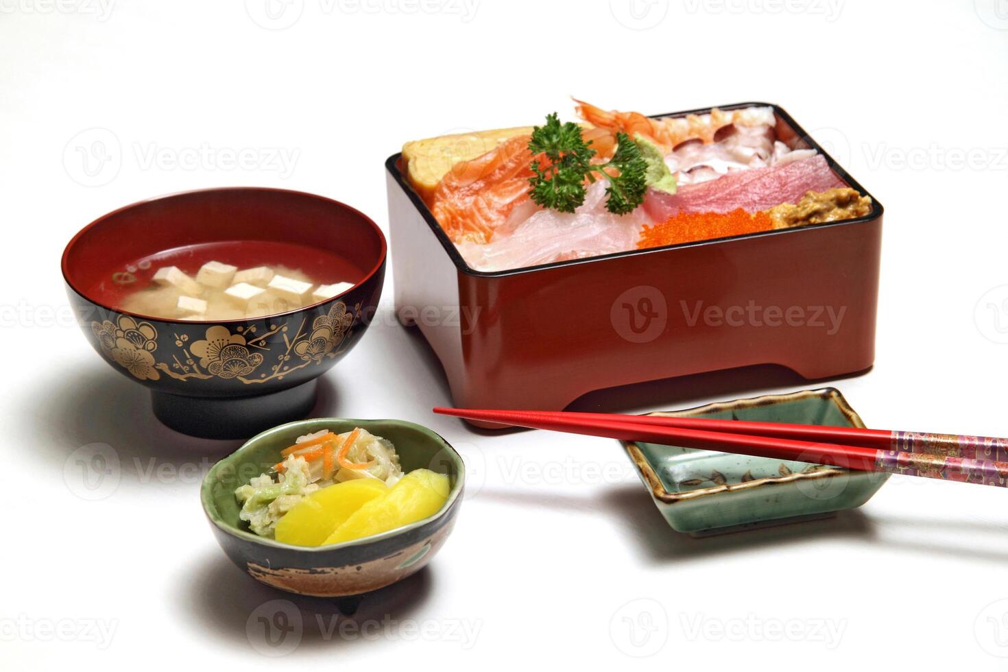 Tirashi, Japanese delicacy with salmon, squid, cucumber, nori, kani kama and salmon roe photo