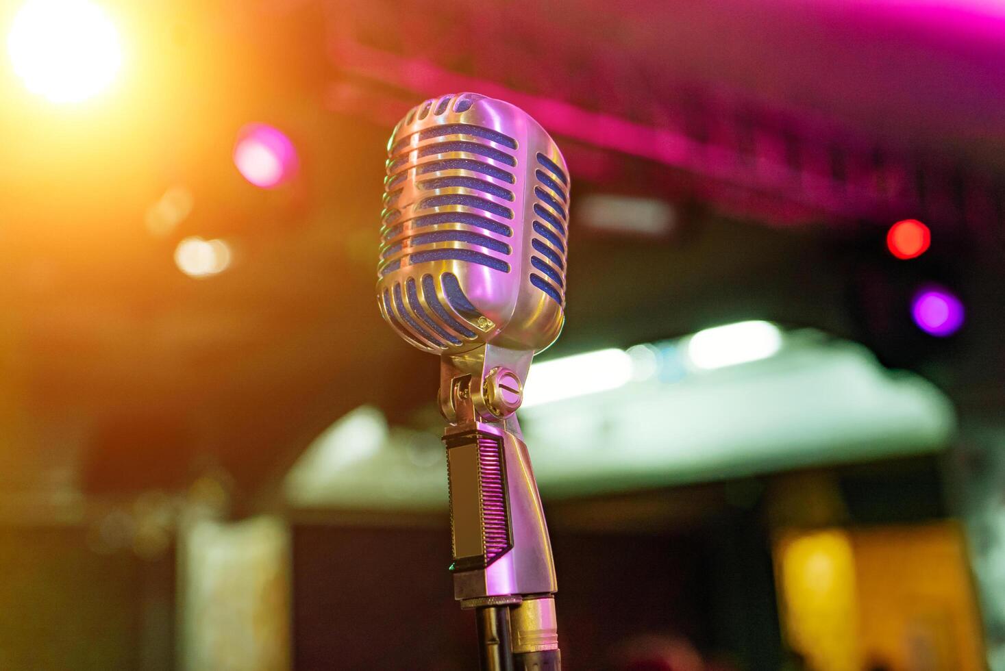Professional microphone is intended for performances in front of audience in concert hall. Closed up photo