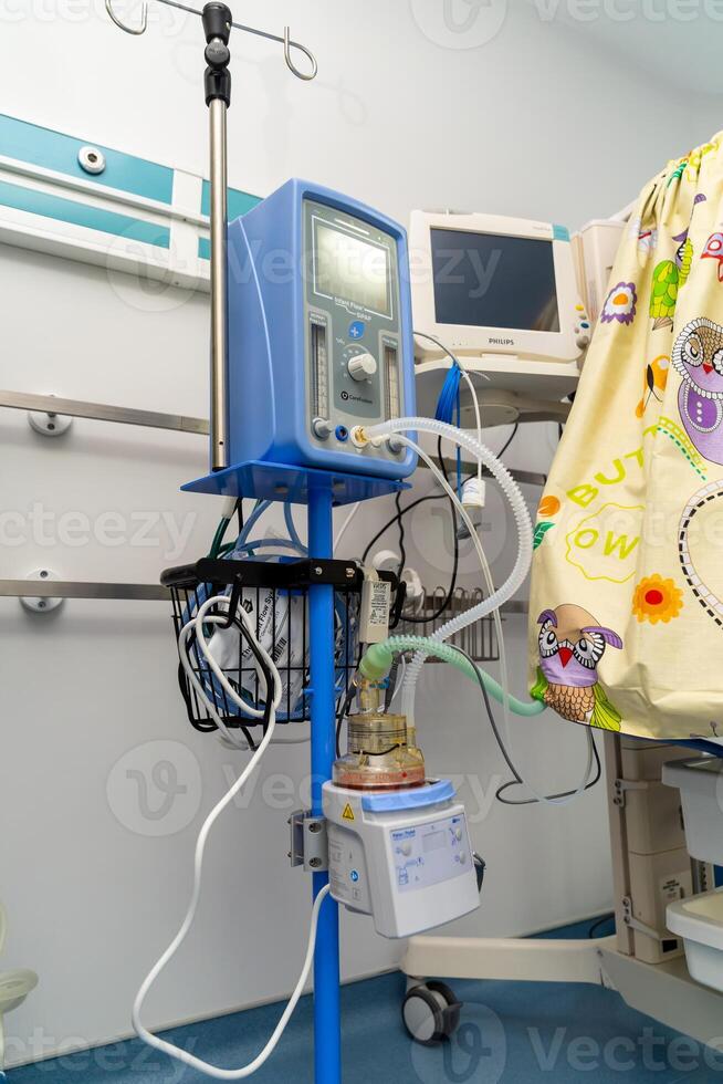 Artificial lung ventilation unit in the medical ward. Selective focus on equipment with oxygen mask. Closeup. photo