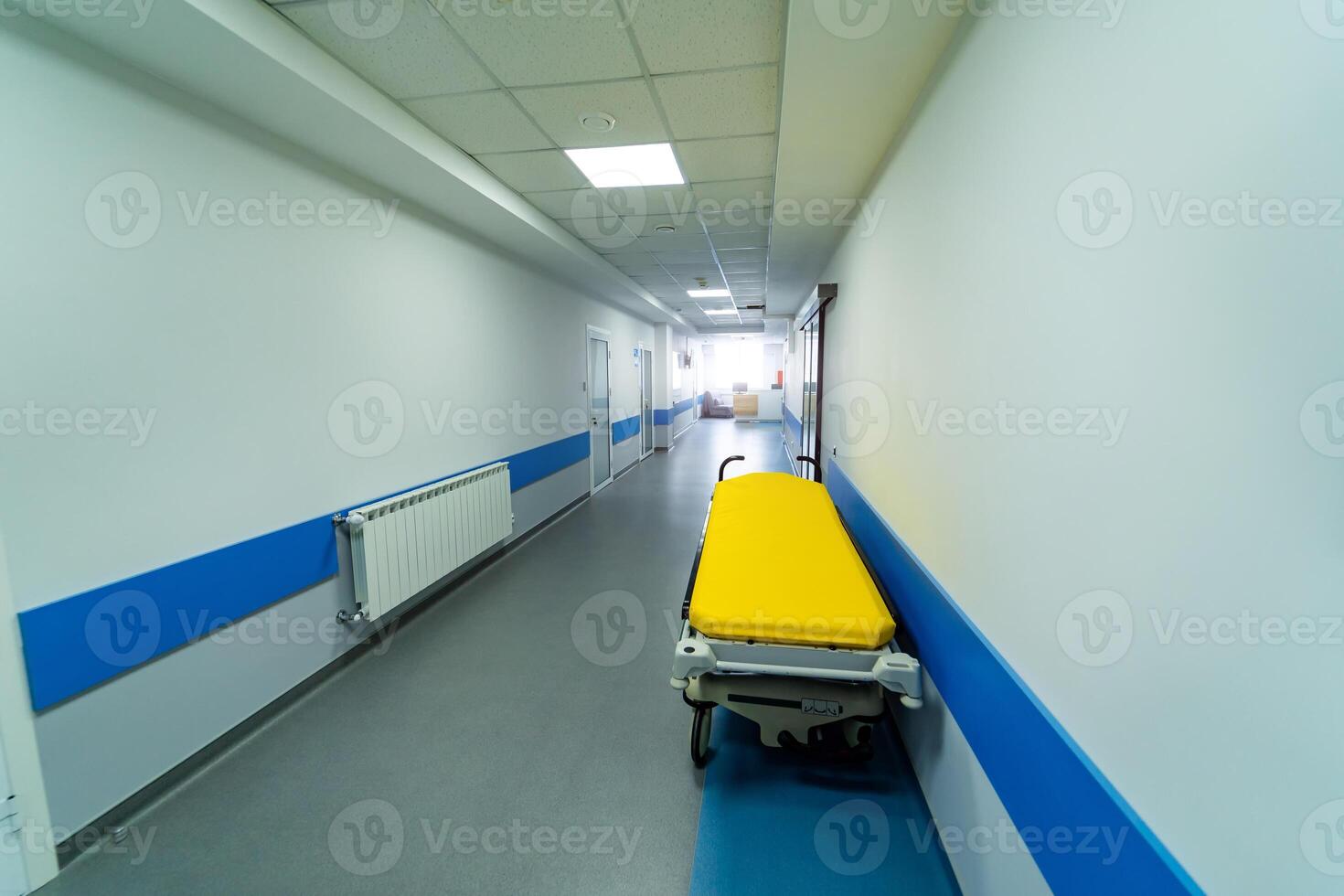 View from above on gurney or emergency bed in empty corridor of a new clinic or hospital. Closeup. photo