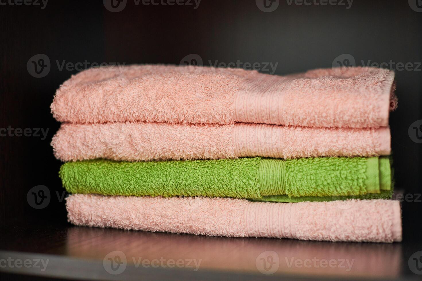 Towels stack on shelf photo