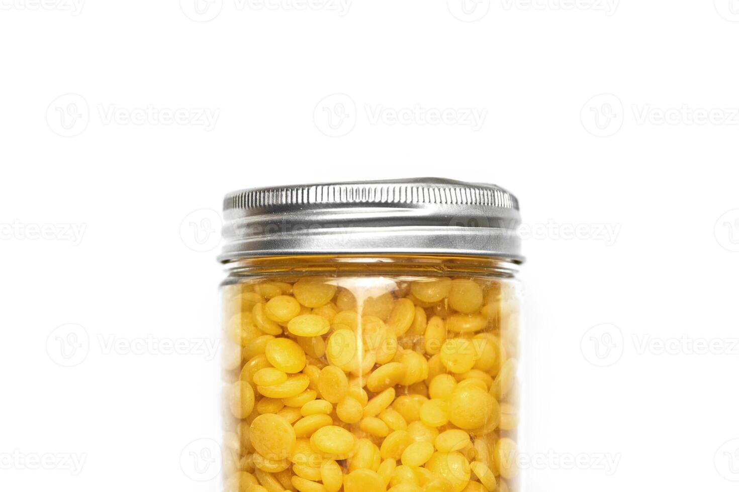 Wax beans for hair removal, isolated. photo