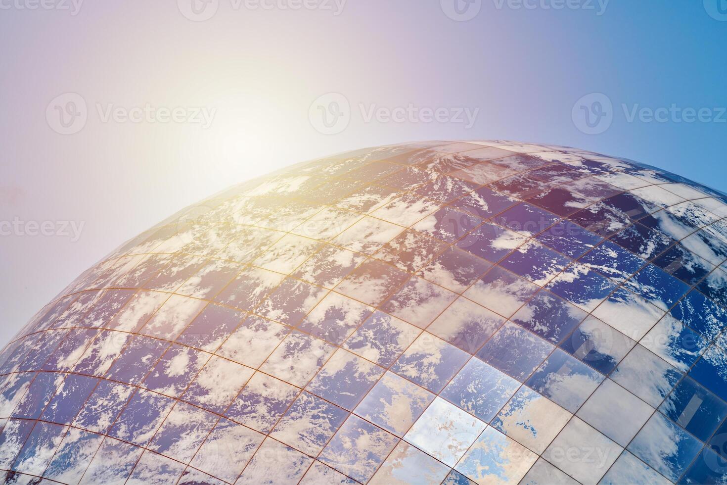 Earth planet modern building with clouds and blue sky in sunlight, ecological architectural concept photo