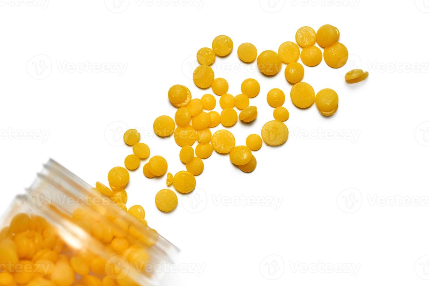 Wax beans for hair removal, isolated. photo