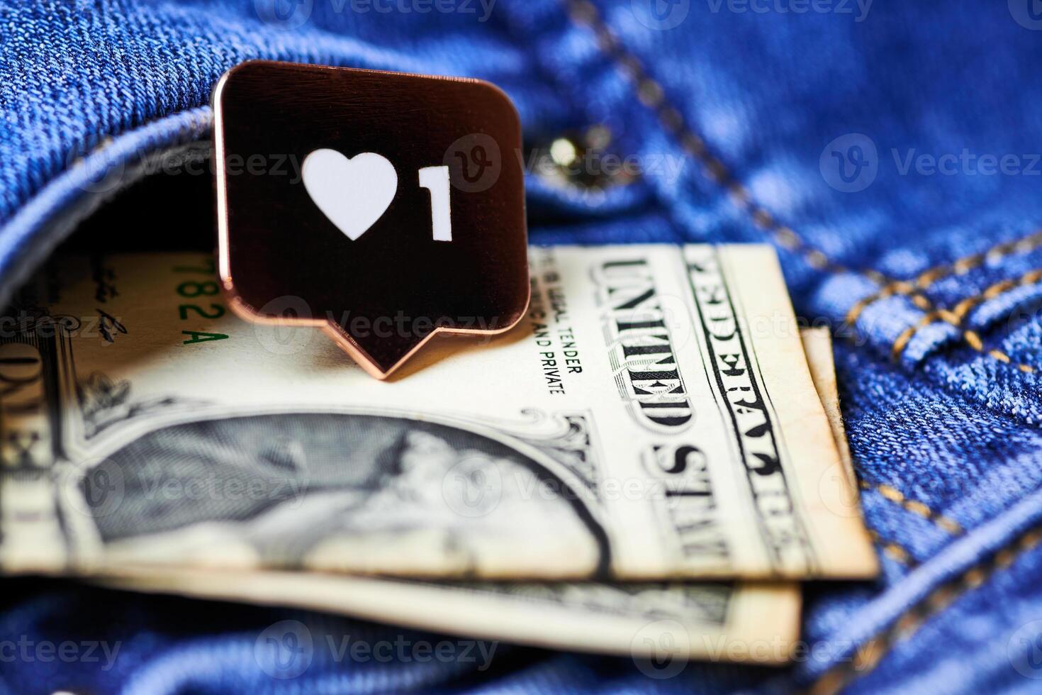 Like heart symbol and dollar in jeans pocket photo