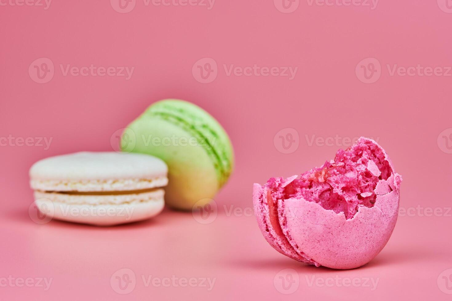 Macaroons on pink background photo