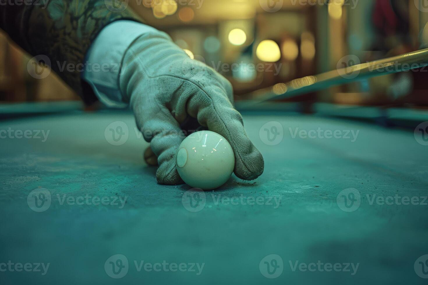 Precision and Focus Gloved Hand Positioning Cue Ball on Billiard Table photo