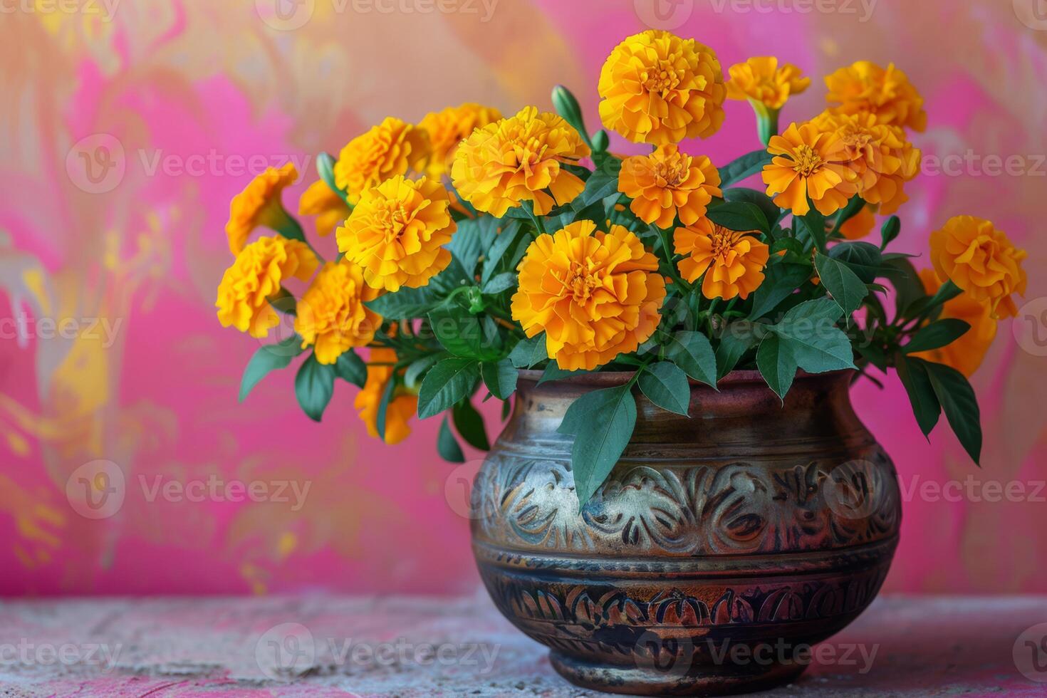 Vibrant Marigolds in a Rustic Pot Against Pink Backdrop photo