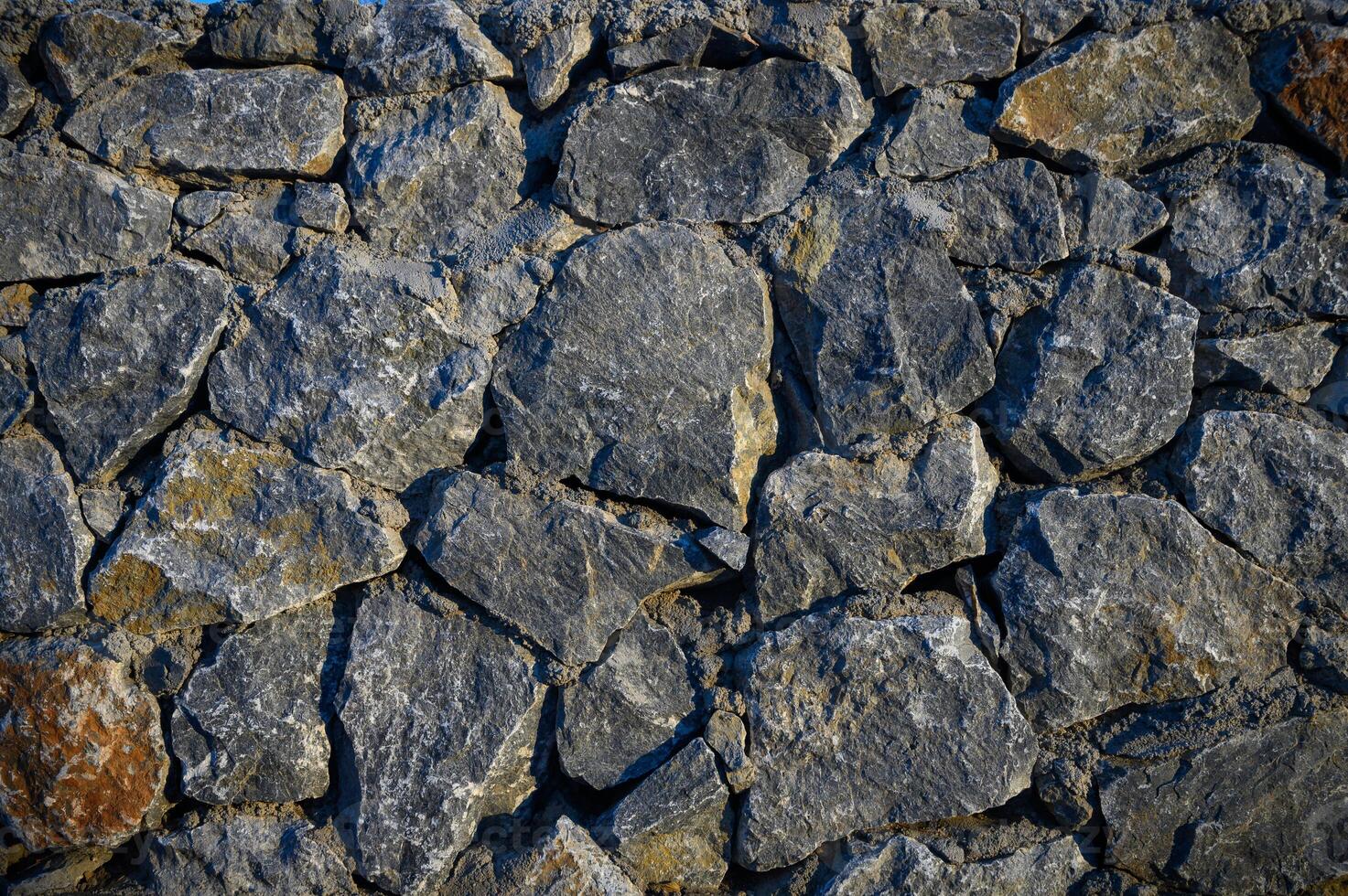 Wall with various size and shaped stones 2 photo