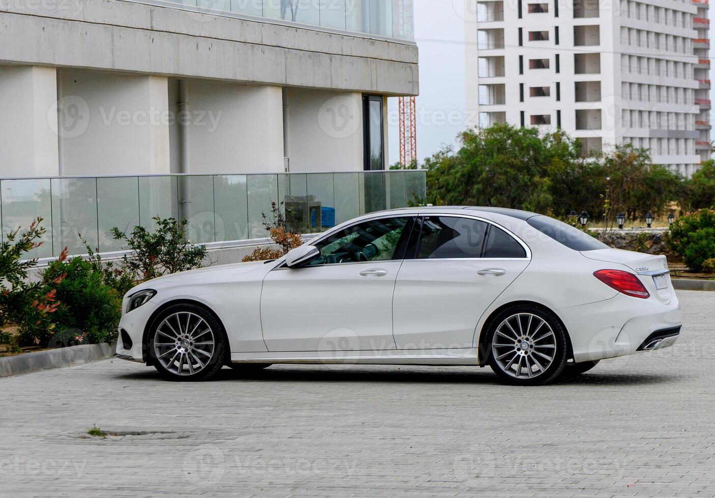 Gaziveren Cyprus 04.24.2024 - white Mercedes Benz C220d in the parking lot near the house 8 photo