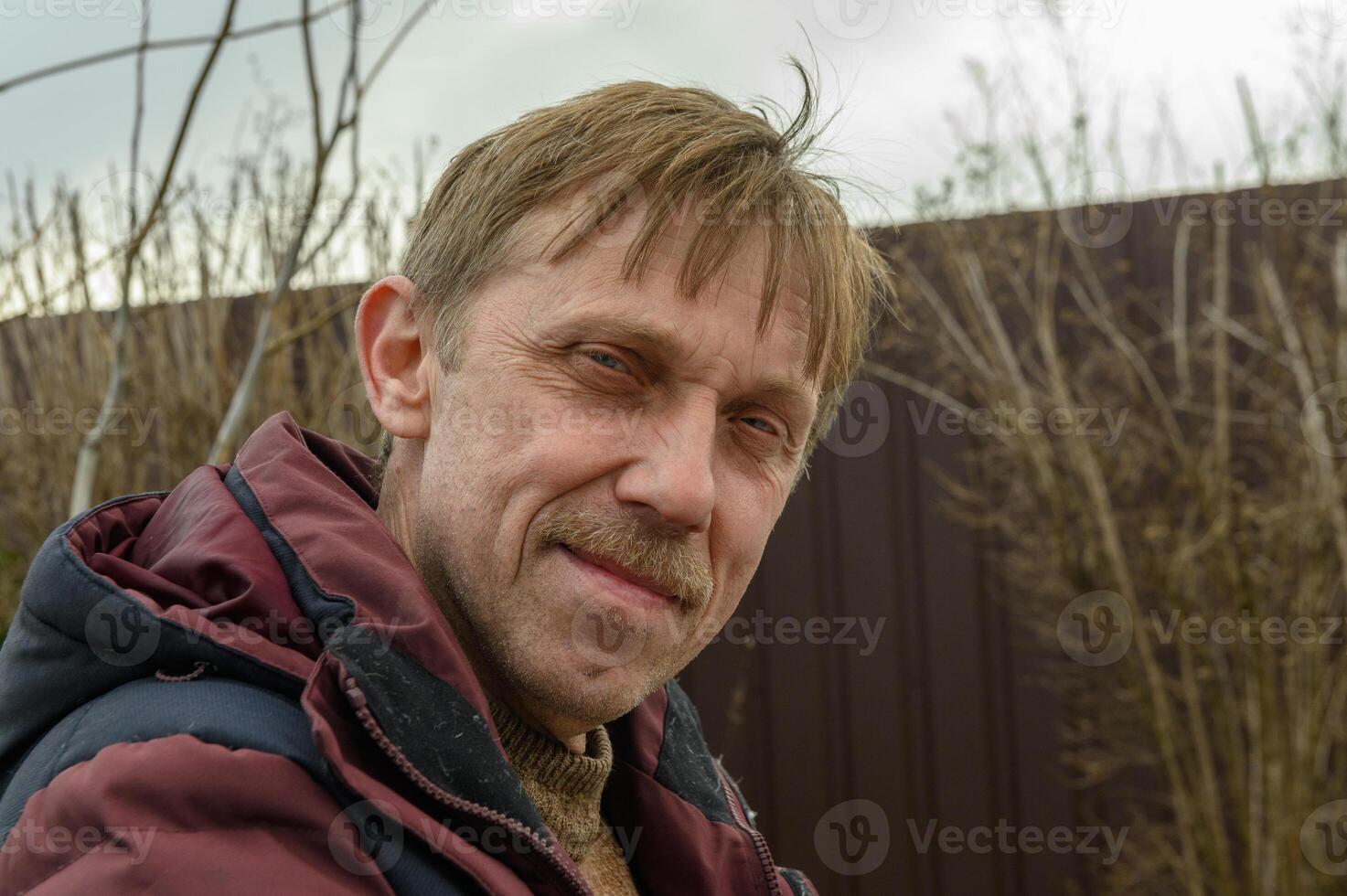 handsome 55 year old man with mustache smiling 1 photo