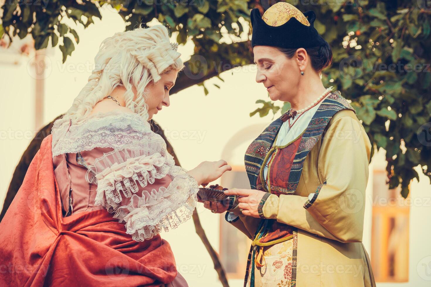Portrait of two woman dressed in historical Baroque clothes photo