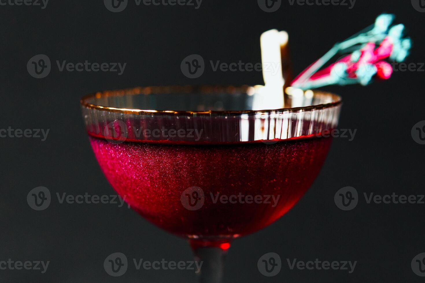 Alcoholic drink. A cocktail with elite alcohol on dark black background photo