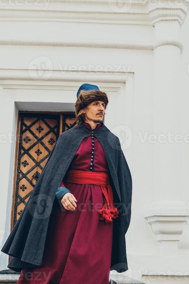 Portrait of a man in a medieval middle class costume. Retro style and historical clothes concepts photo