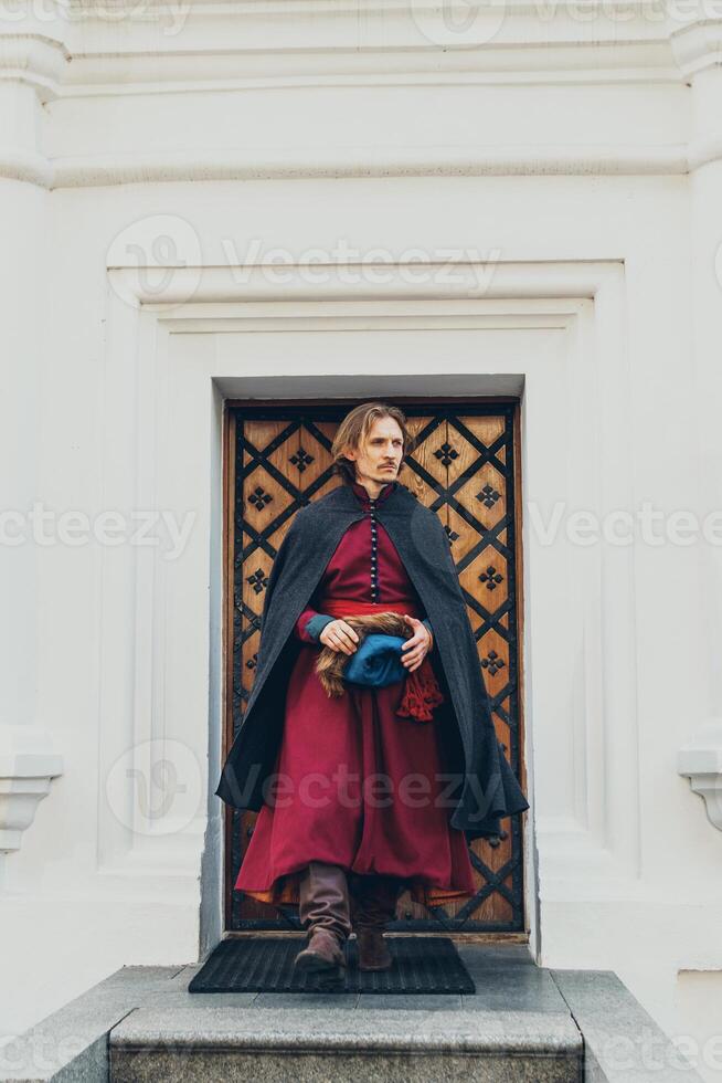 Portrait of a man in a medieval middle class costume. Retro style and historical clothes concepts photo