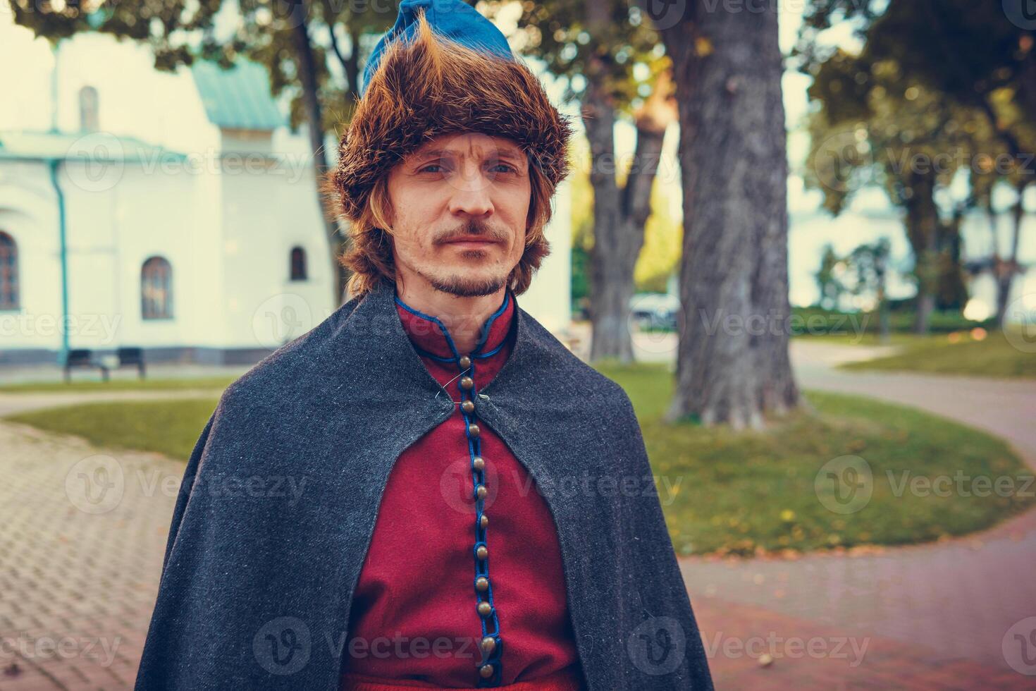 Portrait of a man in a medieval middle class costume. Retro style and historical clothes concepts photo