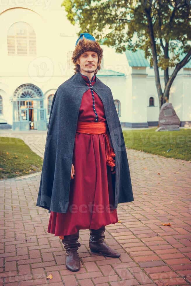 Portrait of a man in a medieval middle class costume. Retro style and historical clothes concepts photo