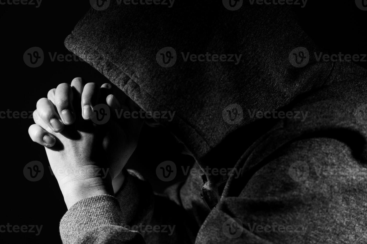Sad and depressed man covering face photo