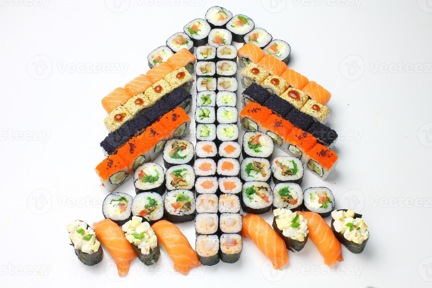 Sushi delivery. Set of rolls in a disposable box on a black background. Top view photo