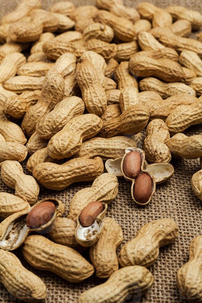Peanut in a shell texture. Food background of peanuts. Close up. Macro photo