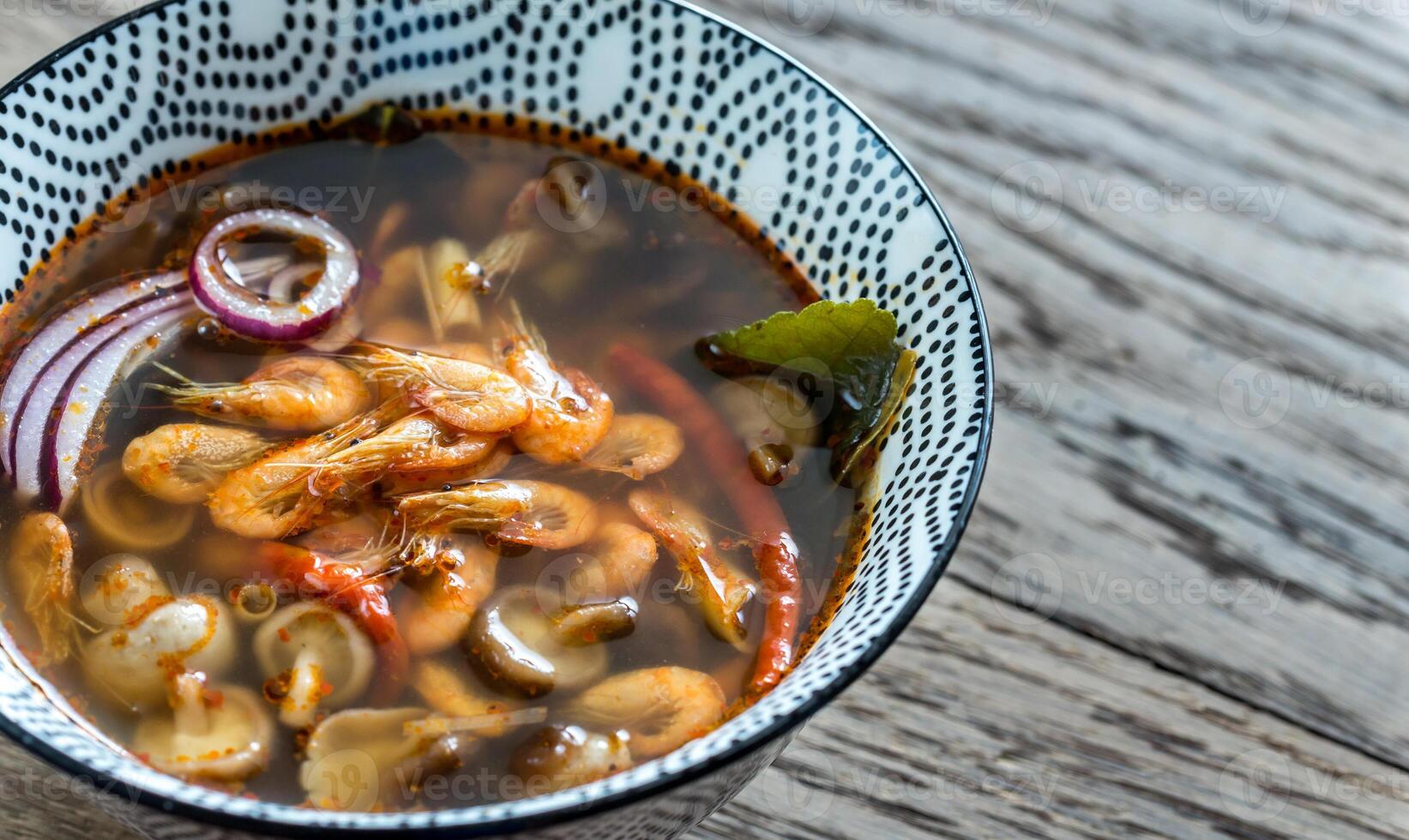 Bowl of thai tom yum soup photo