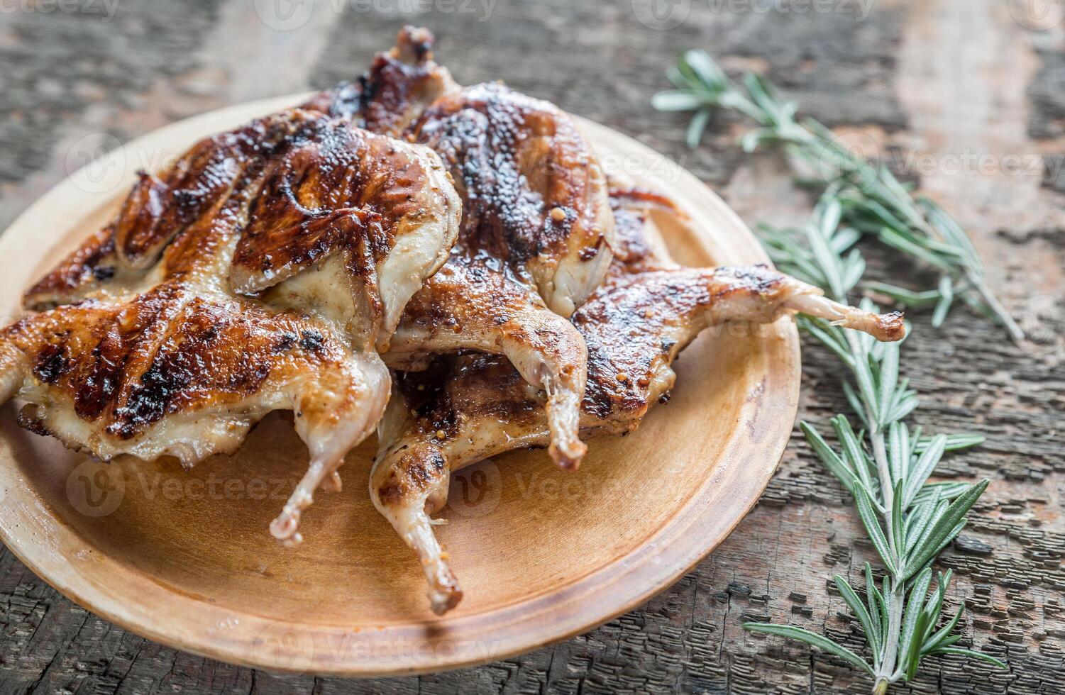 Grilled quails close up photo