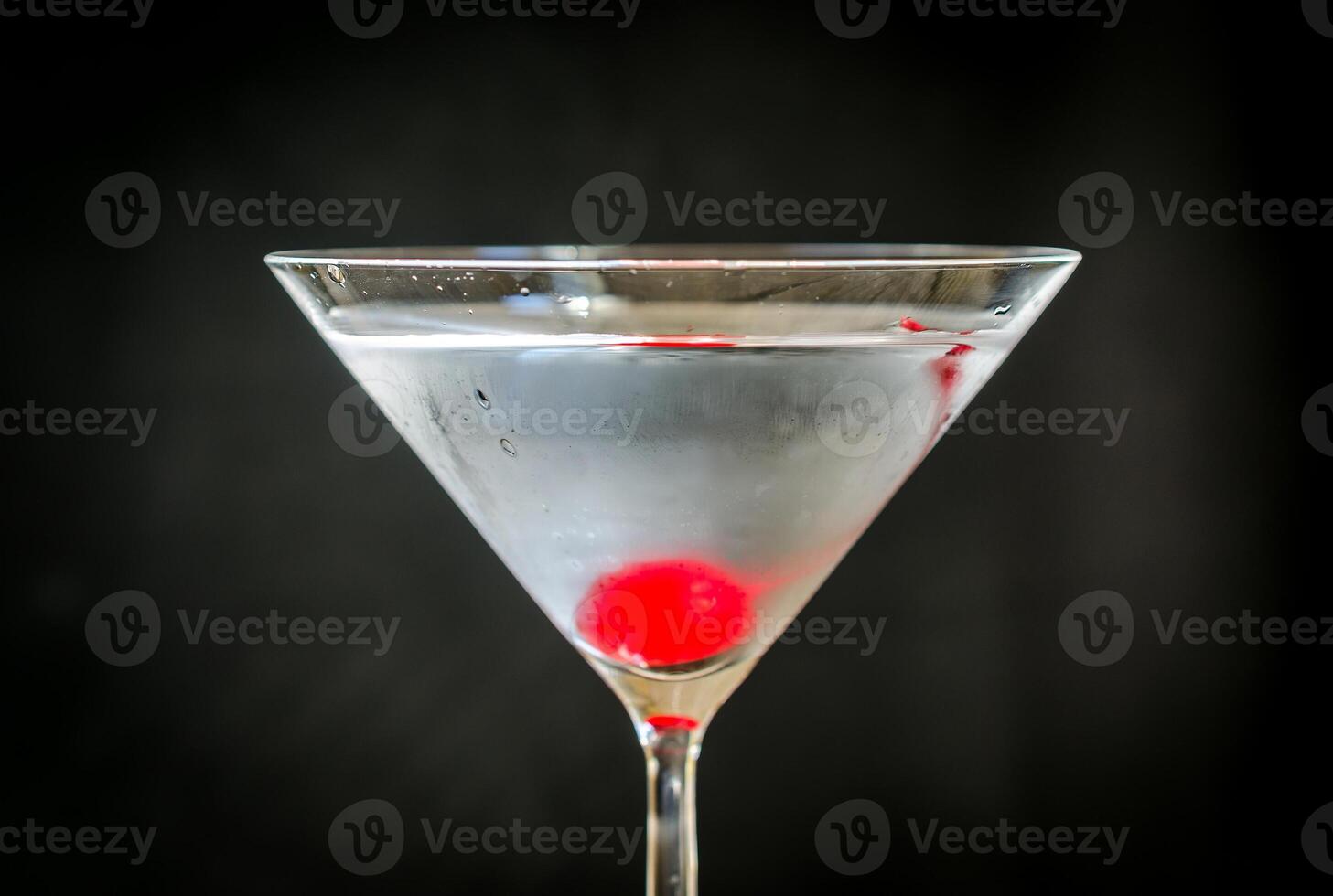 Martini cocktail with maraschino cherry photo