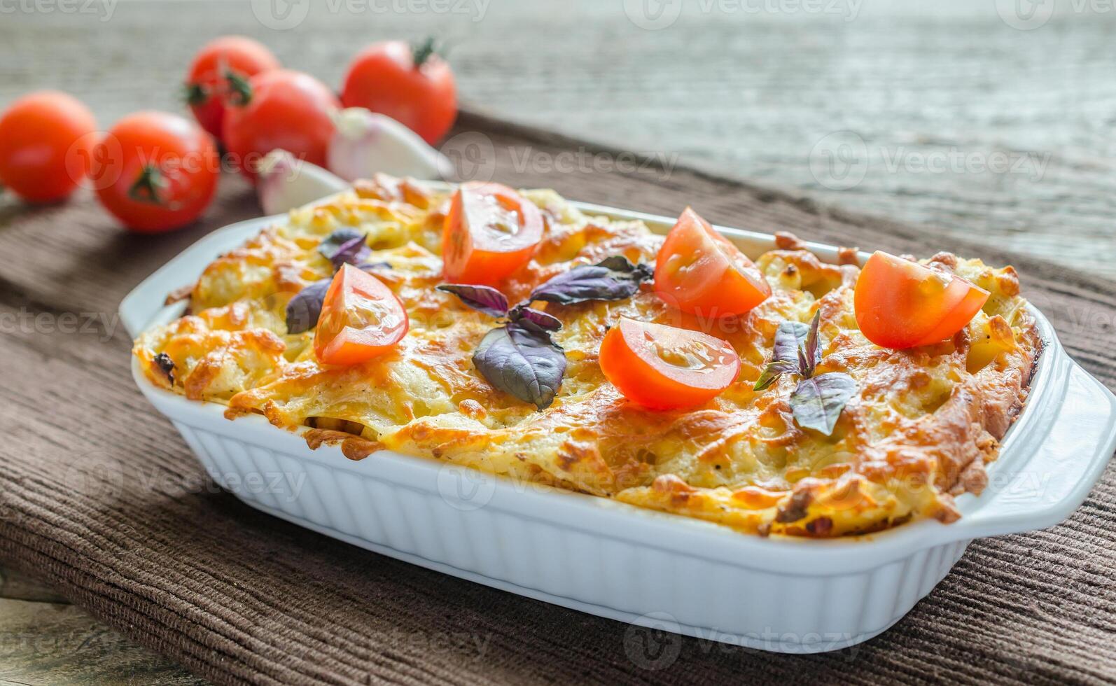 Lasagna with cherry tomatoes photo