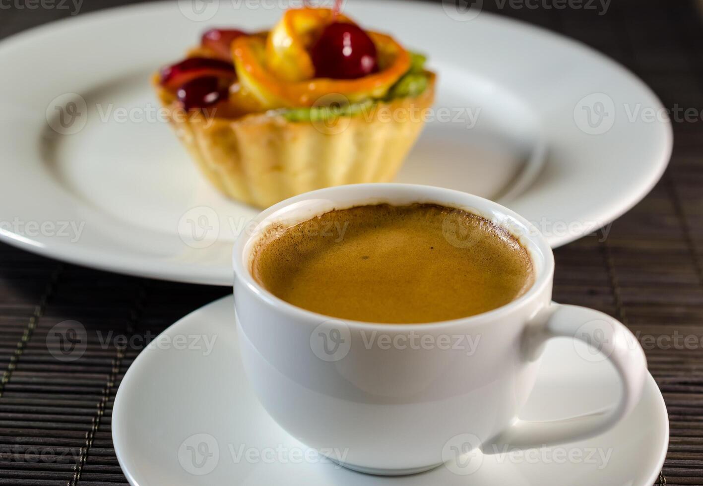 Cup of espresso and dessert photo