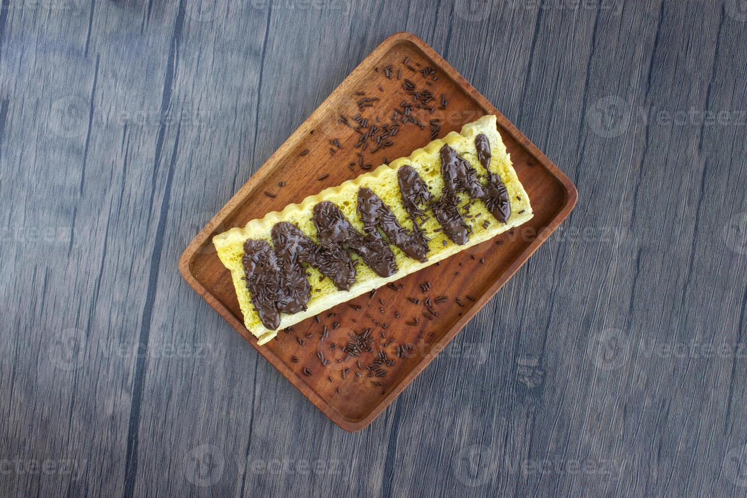 Top view of toast with delicious chocolate sprinkles. photo